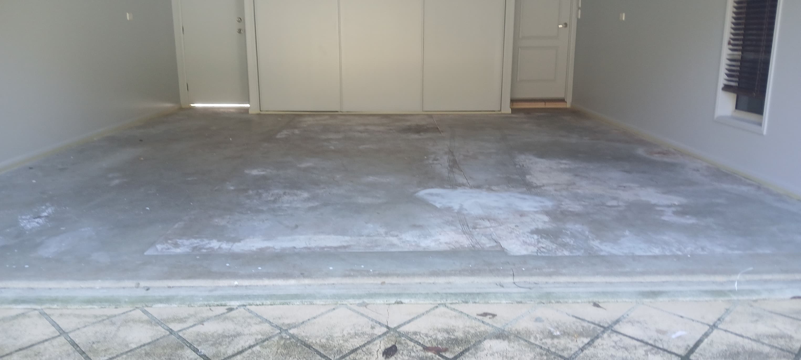 Bare concrete floor before epoxy coating