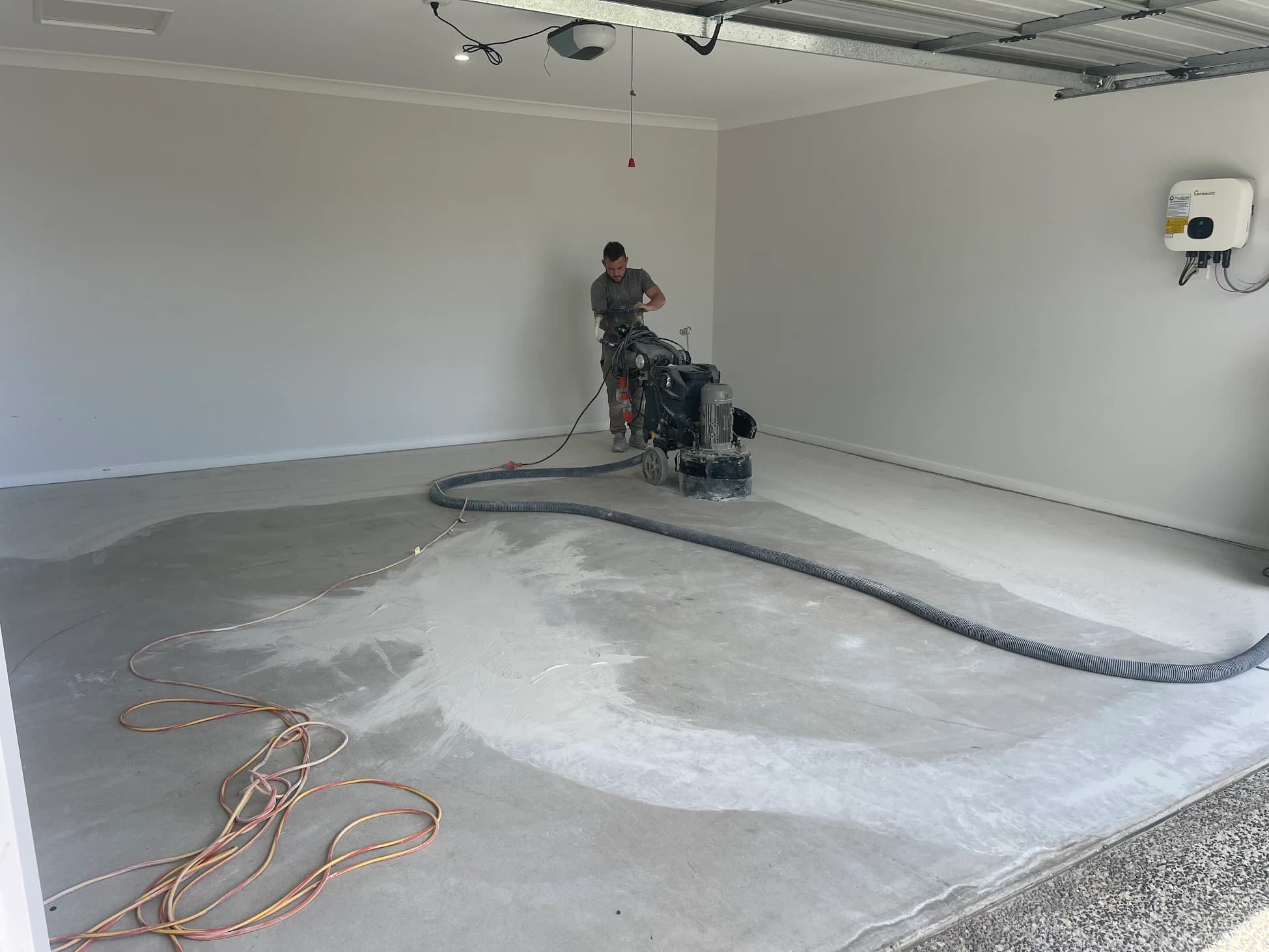 Padraig diamond grinding a concrete floor during surface preparation